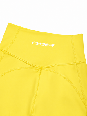 Close-up of the lemon yellow back waistband with the CYBER wordmark above the V seam