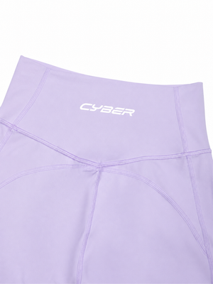 Close-up of the purple back waistband, the white CYBER wordmark over the seam junction