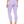 Three-quarter back view on the model in purple, the high waistband and close fit down the leg
