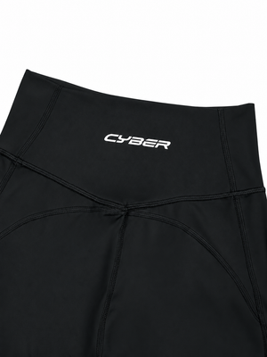 Close-up of the black back waistband, the CYBER wordmark above seams meeting in a V
