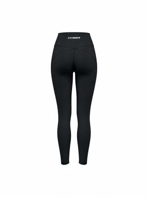 The black leggings shown from the back on a form, the V seam shaping the seat
