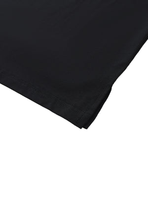 Close-up of the hem corner, folded under and stitched flat on the thin black cotton knit