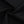 The black cotton and spandex fabric twisted to show its soft, lightly stretchy 200 gsm knit