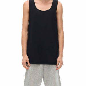 Cyber Loose Black Muscle Shirt on a model, front view, the loose body falling over grey shorts