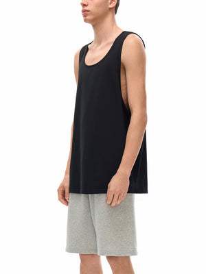 Side view on the model, the armhole cut deep enough to open the whole side of the torso