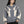Model wearing the Grey Hoodie Y2k Harajuku, front view with the zip closed, cream flame panels and ribbed cuffs