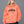 Model with long blonde hair in the Orange sun faded hoodie, hand in the pocket, front view of the CYBER print