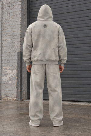 Light Gray matching set seen from the back: sun faded hoodie with small rose print and wide leg sweatpants