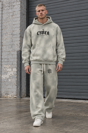 Man wearing the Light Gray sun faded hoodie and matching baggy Y2K sweatpants, full set seen from the front