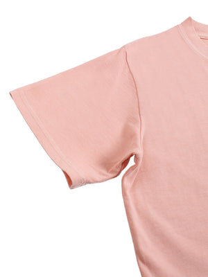 Close-up of the pink crop top sleeve and shoulder seam, short sleeve with a soft washed cotton finish