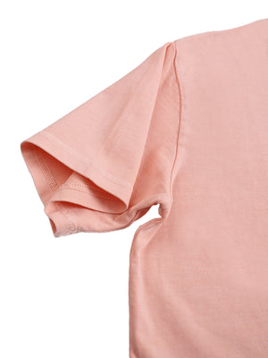Close-up of the pink sleeve hem seen from the side and the stitched armhole of the washed crop top