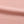 Close-up of the shrimp skin powder pink cotton in soft folds, faded surface with a fine knit texture