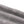 Layers of the grey cotton stacked to show the washed surface and the real weight of the fabric