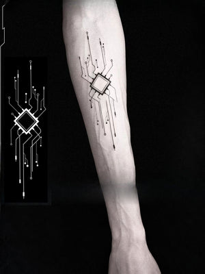 Cyberpunk arm tattoo on a forearm, black circuit board design with a central chip next to the printed sheet