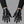 Cyberpunk Mechanical Gloves worn by a person, close-up on both hands, front view on a grey studio background