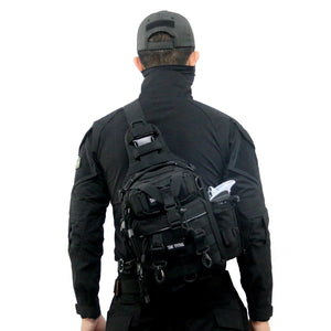 Black and sand cycling techwear sling bag worn across the body