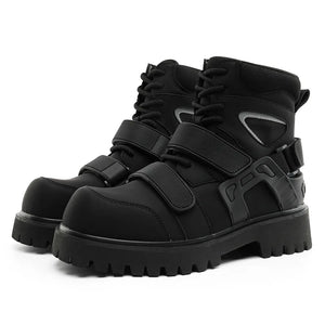 Deconstructed high top techwear boots worn with tapered trousers
