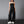 Black denim strapless jumpsuit with multiple cargo pockets and a wide leg