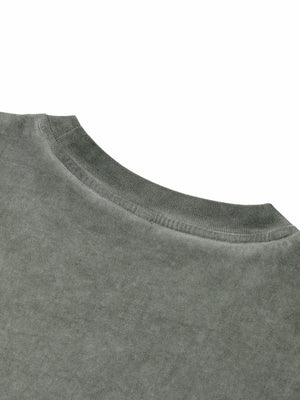 Detail of the ribbed crew collar and the shoulder seam on the faded grey garment washed cotton
