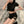 Double Buckle Goth Shorts worn in three-quarter view, hand on hip, double strapped cut-out on the leg