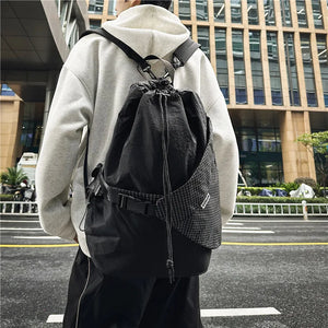 Beige and black drawstring techwear backpack, 20 to 35 litres