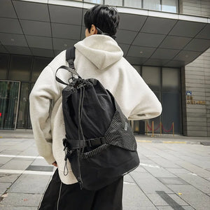 Beige and black drawstring techwear backpack, 20 to 35 litres