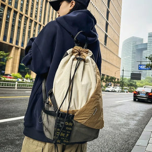 Beige and black drawstring techwear backpack, 20 to 35 litres