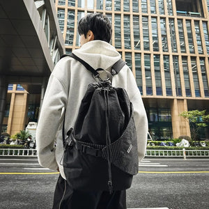 Beige and black drawstring techwear backpack, 20 to 35 litres