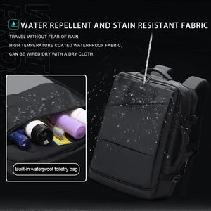 Black business backpack with an expandable main compartment and a luggage strap