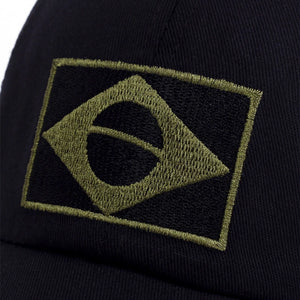 Camouflage trucker cap with an embroidered flag patch and mesh back