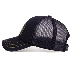 Camouflage trucker cap with an embroidered flag patch and mesh back