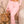 Pink high waisted flare cargo pants in front view, drawstring waist and flap pocket with a long tie strap