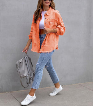 Orange distressed denim shacket worn open, walking full length view with a grey backpack and sneakers
