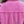 Close-up of the Rose Red jacket back, frayed raw edge across the yoke and a ripped patch below