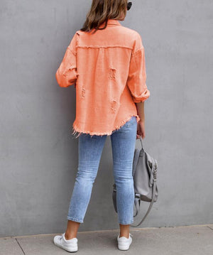 Back view of the Orange distressed shacket with a curved frayed hem and frayed yoke seam