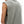 Close view over the model's shoulder, the raw armhole edge curling slightly with wear