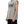 Side view on the model, the armhole cut deep so the whole shoulder stays uncovered