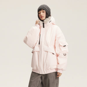 Pink short parka with a fluffy hood trim worn with a grey beanie, three-quarter front view, hand on the collar