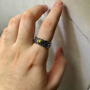 Golden Sun Textured Y2K Ring worn on the middle finger, hand flat on marble, sun facing up