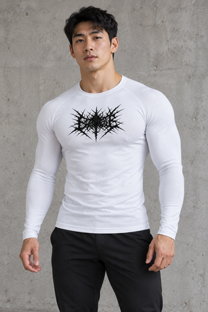Goth Long Sleeve Compression Shirt on a man against a concrete wall, front view, black gothic print on white