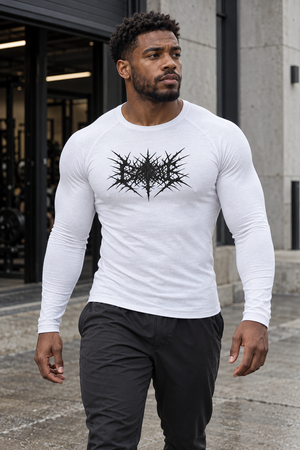 A man walks out of a gym in the white compression shirt with black trousers, the print across the chest