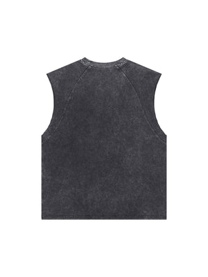 Washed black tank top laid flat from the back in a wider shot, plain faded fabric and boxy sleeveless cut