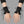 Goth Wrist  Gloves PU Leather worn by a person, close-up on both hands, front view on a grey studio background
