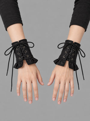 Goth Wrist  Gloves PU Leather worn by a person, close-up on both hands, front view on a grey studio background