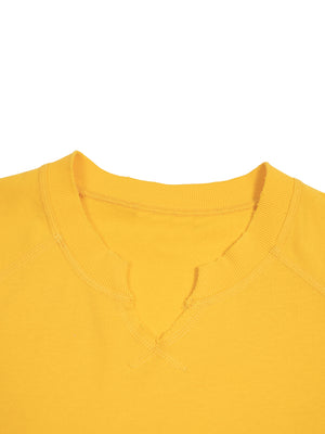 Collar detail in yellow: ribbed neckband opening on a small split V, bar-tacked at the point