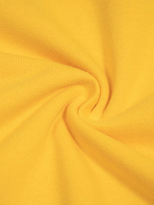 Close up of the yellow knit swirled, 250 gsm midweight cotton and polyester with a soft surface