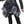 Gothic Mini Skirt Black front view, plaid asymmetric hem with star prints and wide eyelet belt on a model