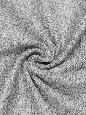 Close-up of a flat seam across the heathered gray knit of the long sleeve compression shirt