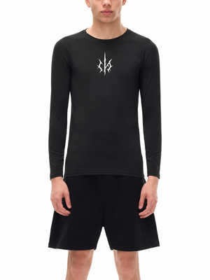 A model wears the black shirt with black shorts, front view, the raglan sleeves fitted to the wrist