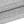 Close-up of the bottom hem stitching on the Flecking Gray gym compression shirt, stretch knit fabric
